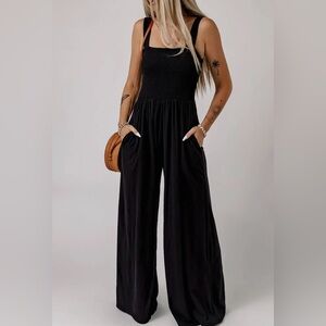 Black smocked bust jumpsuit with pockets NWT